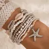 Pulsera trenzada con cuentas de concha estilo bohemio nuevo transfronterizo, estilo playa, juego de siete piezas de cuentas de arroz y estrellas de mar