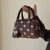 Nuevo bolso de mano cruzado de moda para mujer, exquisito, de ante, para ir al trabajo, otoño 2026, de un solo hombro, con estampado de lunares de bola de boliche