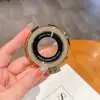 Adecuado para hombres y mujeres, soporte de anillo invisible portátil, soporte de carga magnético multifuncional para teléfonos Apple, modelo universal con patrón de CD