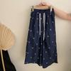 Top de manga corta de verano estilo coreano para niñas con estampado de letras, pantalón casual con lazo que combina con todo, moderno conjunto de dos piezas para niños