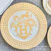 Plato de cena occidental de porcelana de hueso con borde dorado estilo europeo transfronterizo, decoración para sala de modelos, mesa de sala, plato plano de cerámica para el hogar