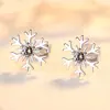 Aretes de botón de copo de nieve de plata de ley S925