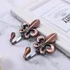 Gancho de pared de aleación de zinc moderno y simple con forma de flor grande gancho de pared gancho de pared accesorios para cortinas al por mayor gancho de cortina perforado suministro transfronterizo
