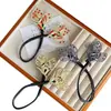 Pinza de pavo real retro de alta gama para mujer, herramienta para moño alto de flor en la parte posterior de la cabeza, clip de torsión para moño perezoso, accesorio para el cabello
