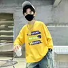 Camiseta de manga comprida de outono para meninos, novo modelo primavera e outono 2026, base de algodão puro, blusa infantil grande, moderna