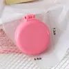 Nova escova de airbag de macaron, cor sólida, portátil com espelho, escova massageadora para meninas, pente dobrável para cabeleireiro na cor de doce