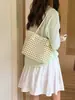 2026 Verano Nuevo Estilo Coreano Piel Suave Tejida Cesta Hueca Moda Bolso de Mano para Vacaciones Bolso Tote para Hombro/Axila
