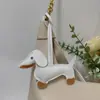Colgante de Perro Salchicha Nuevo Transfronterizo Dibujos Animados Colgante de Bolsa de Cachorro de Cuero Accesorios para Funda de Teléfono Móvil Accesorios Creativos para Coche