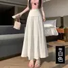 Saia Feminina 2026 Verão Nova de Cintura Alta Moda Plissada Cobrindo o Quadril Emagrecedora Fluida de Comprimento Médio com Barra Larga
