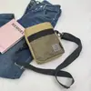 Estilo Coreano Marca de Moda Unisex Bolso Pequeño de Lona para Hombro Casual para Viajar Bolso Cuadrado Pequeño Transfronterizo Bolso de Hombro de Moda para el Trabajo
