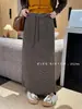 Falda de punto a rayas estilo francés con abertura trasera para mujer, nueva falda recta casual elegante versátil de cintura elástica para otoño e invierno