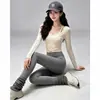 Conjunto deportivo de yoga de secado rápido para mujer, con un top de manga larga protector del sol y pantalones deportivos elásticos y transpirables, un atuendo versátil para el día a día
