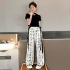 Traje de verano para niñas Conjunto de verano para niños Pintura a tinta Pantalones anchos Conjunto de dos piezas estilo chino Niñas Manga corta Celebridad de Internet Holgado Moderno