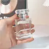 Botella dispensadora de perfume de alta gama 30 ml Marca grande Co Botella rociadora 50 ml Presión de vidrio portátil Botella vacía 100 ml