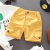 Pantalones cortos casuales para niños estilo coreano 2026 verano nuevos pantalones para niños bebé color sólido pantalones de longitud media modernos