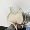 Bolso Cruzado de Hombro Único con Colgante Texturizado Color Sólido Casual Estilo Coreano Verano 2026 Nuevo Elegante Bolso Dumpling para Mujer