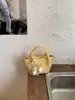 Bolso Pequeño de Alta Gama Elegante Transfronterizo 2026 Nueva Versión Coreana Bolso para Mujer Versátil de Moda Bolso Cruzado Bolso de Mano Bolso Cubo