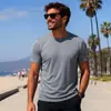 Nova camiseta de manga curta estilo europeu e americano para homens, secagem rápida, adequada para esportes, corrida, treinamento físico e uso casual, disponível em estoque