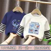 Camiseta de manga larga de algodón puro con retazos para niños, nuevo estilo primavera/otoño, diseño de dibujos animados, casual y versátil, parece un conjunto de dos piezas, moderno