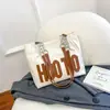 Bolsa grande popular para mujer 2023 otoño e invierno Nueva bolsa de mano con letras versátil gran capacidad Bolso de hombro para clase de estudiante universitario