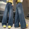Atacado transfronteiriço de jeans de outono para meninas, novas calças estilosas de perna larga, calças retas de corte solto para crianças e pré-adolescentes