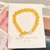 Pulsera de ágata amarillo natural con cuentas para mujer, accesorio cultural y creativo de bucle único de jade Hetian, ágata amarillo al estilo chino. El robo de imágenes será procesado