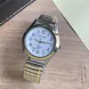 Banda de Acero Elástica al por Mayor No Impermeable Luminosa Reloj Elástico Reloj de Cuarzo para Personas de Mediana Edad y Mayores con Números Grandes Reloj de Pareja