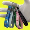 Chaveiro de Pulseira de Silicone Impressão de Logo em Relevo Personalizado Pulseira de Silicone com Fivela Fábrica Atacado