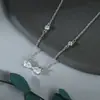 Cadena de Clavícula Elegante con Circonita Chapada en Oro Real para Mujer Diseño de Nicho Collar de Lazo Moda Cadena para Suéter Todoterreno