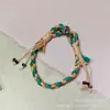 Lanyard de teléfono colorido tejido a mano, correa de muñeca de estilo étnico, cordón anti-pérdida con borla y cuenta, adorno colgante para funda de teléfono, venta al por mayor