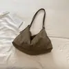 Bolsa de mão estilosa e casual com um toque único e descontraído, perfeita para o outono de 2026; uma bolsa tiracolo simples e versátil para o trabalho e o trajeto