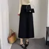 Saia midi lisa e moderna, nova coleção outono/inverno 2026, saia de malha elegante e casual, cintura alta, afina o corpo, com caimento.