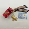 Chaveiro Popular de Ouro Puro 999 com Símbolo de Boa Sorte, Decoração para Capa de Celular, Presente para Amigos, Presente Empresarial, Atacado