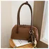 Bolso de axila retro de nicho para mujer, nueva moda otoño/invierno 2026, elegante bolso de hombro para el trabajo y los desplazamientos, bolso baguette simple