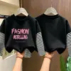 Linda camiseta básica de manga larga para niñas, colección primavera/otoño 2026, camiseta elegante de cuello redondo, algodón puro, aspecto en capas, para niños de talla mediana y grande