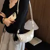 Bolso de mujer de nicho de lujo ligero 2026 nuevo diseño de moda, bolso versátil para hombro y bandolera con sensación de alta gama, bolso de cuerno, bolso tipo dumplings