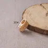Suministro de fábrica zapatos cabeza de tigre de madera de durazno zapatos bordados paso a paso Wang zapatos pequeños pulsera de pasos arreglo de pequeños accesorios cabello humano