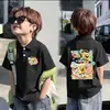 Camisa Polo Fina de Manga Curta 100% Algodão para Meninos e Meninas Verão 2026 Novo Estilo Infantil Versátil Estampada com Gola