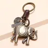 Pingente de elefante de liga metálica trançado à mão criativo personalizado retrô chaveiro de couro de vaca joias simples para e-commerce transfronteiriço
