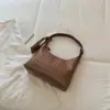 Bolso de mano de color liso con diseño único y patrón tejido, alta estética, simple y elegante para el trabajo y los desplazamientos, de hombro y de mano