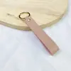 Chaveiro de PU de cor sólida transfronteiriço, cordão de mão de couro de cor doce criativo, chaveiro de carro simples para homens, atacado
