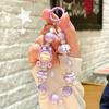 Nueva cadena creativa para teléfono móvil con muñeca Lilith, cuentas pintadas a mano, colgante para teléfono móvil, accesorios para llavero de bolso al por mayor