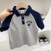Camiseta polo infantil de manga curta versão coreana do verão 2023 masculina bebê listrada solta com gola polo uma geração de cabelo
