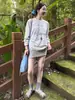 Camiseta de Manga Longa com Estampa de Lírio Estilo Coreano para Mulheres no Outono Retrô Preguiçosa e Relaxada Solta Casual Gola Redonda Pulôver
