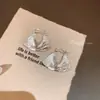 Pendientes de anillo liso exagerado con aguja de plata S925 de estilo europeo y americano para mujer, pendientes de temperamento simple Joker de lujo ligero de alta gama, venta al por mayor