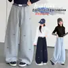 Calça pantalona xadrez patchwork para meninas, novo estilo outono, calça de moletom infantil folgada com bordado de laço, calça casual para crianças maiores