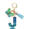 Llavero de Resina con Lentejuelas Azul Cian Letra Llavero con Borla de Mariposa Colgante Pequeño para Mujeres Pareja Venta Caliente Transfronteriza