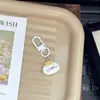 Chaveiro fofo de desenho animado de foca adorável, bolinho de pudim, charme feminino para mochilas de estudantes, presente para melhores amigos
