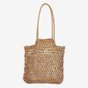 Bolso de paja de color sólido al por mayor de fábrica, nuevo bolso de paja hueca, bolso tejido, bolso de playa para vacaciones en la playa, bolso de hombro de moda