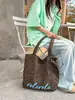 Bolso de lona con estampado de leopardo de gran capacidad para mujer, nuevo 2025, bolso de hombro versátil casual vintage de principios de otoño, bolso de mano para el trabajo
